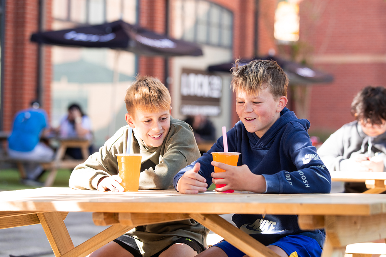 Children sat on the Waterfront at Lock29 in Banbury drinking Boba Bros.